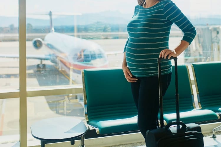 Pregnant woman at airport