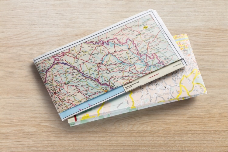 Have two navigation methods, including a physical map, when you are taking a solo road trip